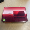 Boxed metallic red Nintendo 3ds console