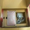 Boxed metallic red Nintendo 3ds console