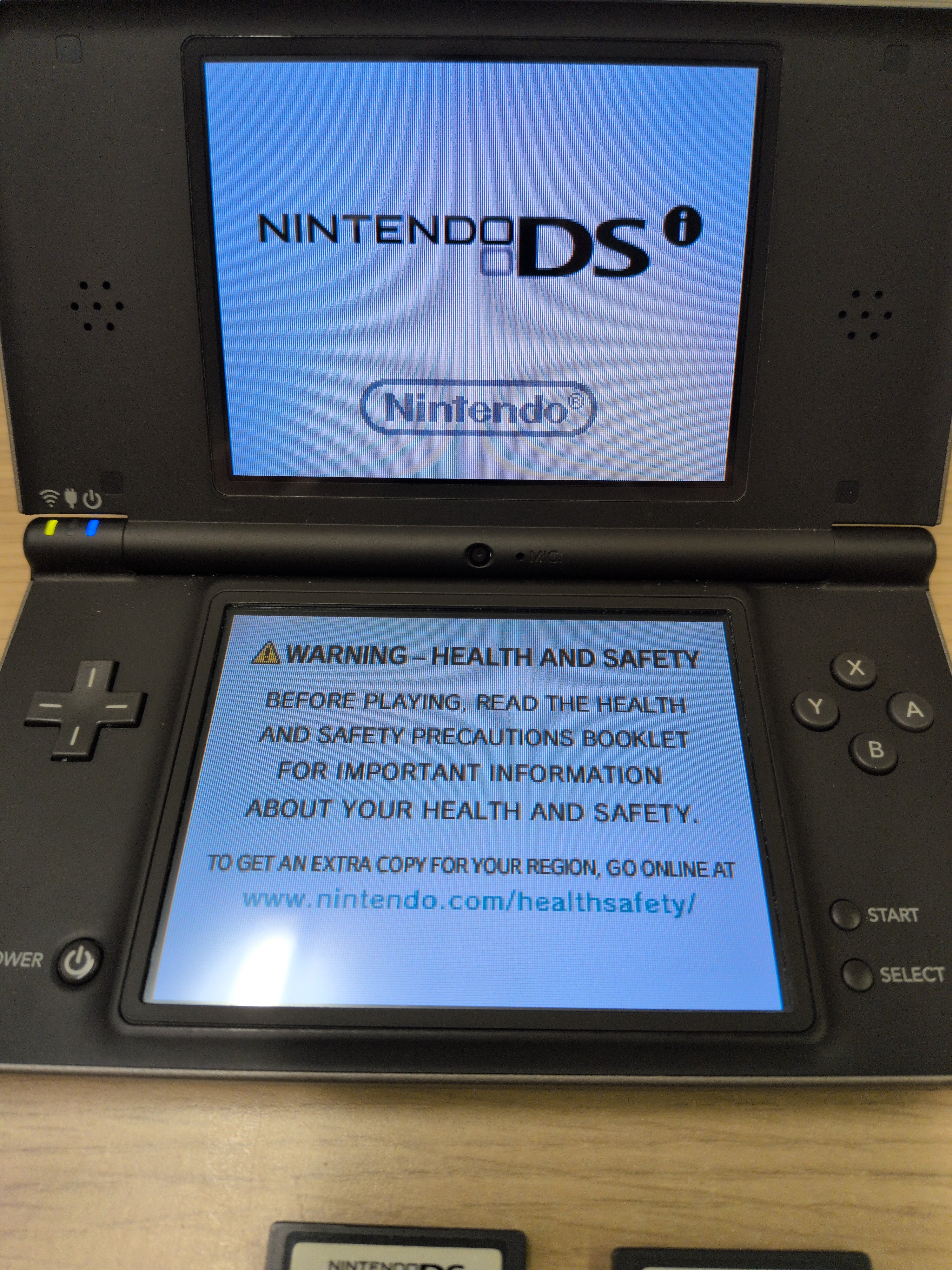 Nintendo DSi XL Handheld Dark Brown & Games Bundle