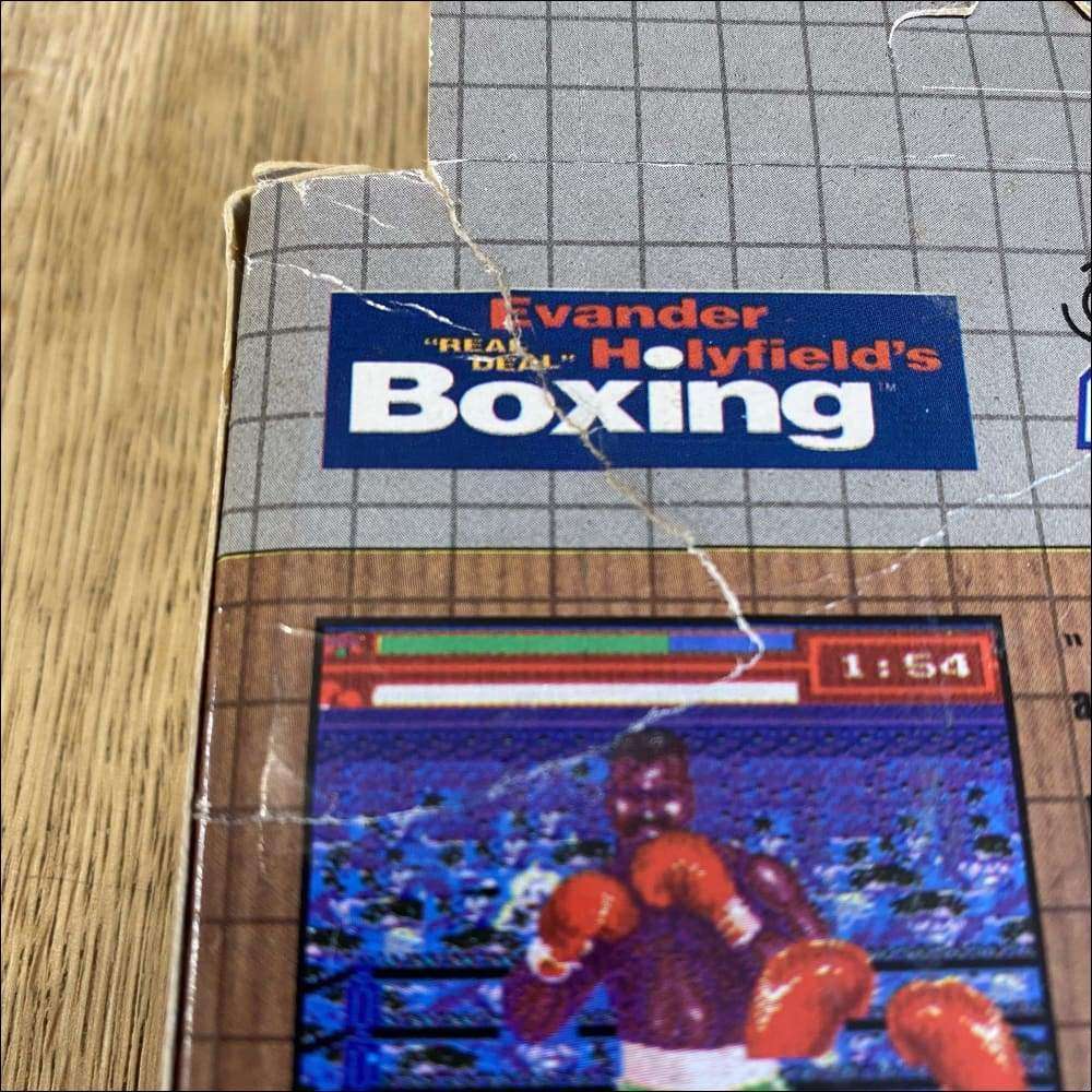 Buy Evander Holyfield's Real Deal Boxing Classic brown box -@ 8BitBeyond